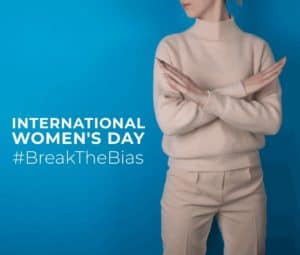 A visual for IWD2022 with woman corming x with her arms on blue background, symbolizing the motto #BreakTheBias